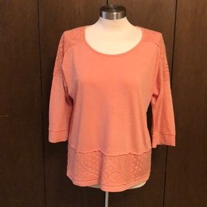 An orange top from Chico’s.
